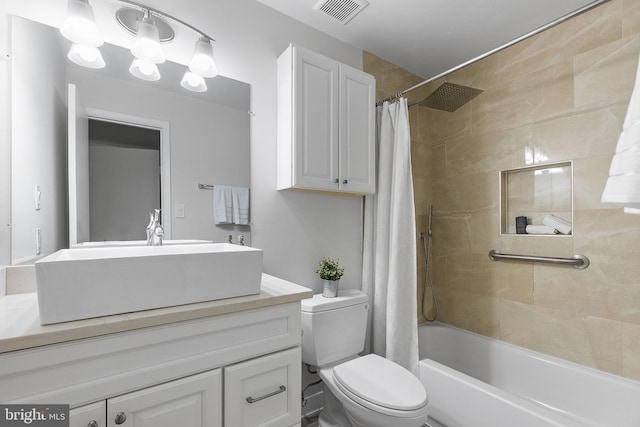 full bath with toilet, visible vents, shower / tub combo with curtain, and vanity