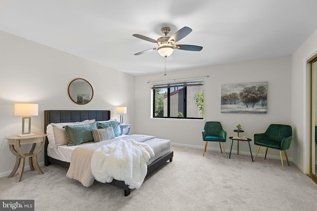 bedroom featuring baseboards, ceiling fan, and carpet floors