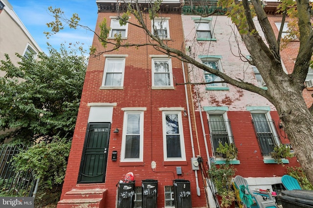 1557 N 9th St, Philadelphia, PA 19122 - townhome / multi-family property with brick siding and entry steps