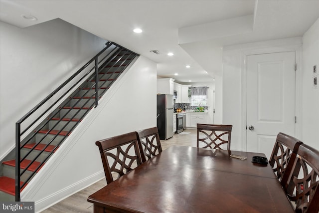 1557 N 9th St, Philadelphia, PA 19122 - dining space featuring recessed lighting, stairway, visible vents, and light wood finished floors