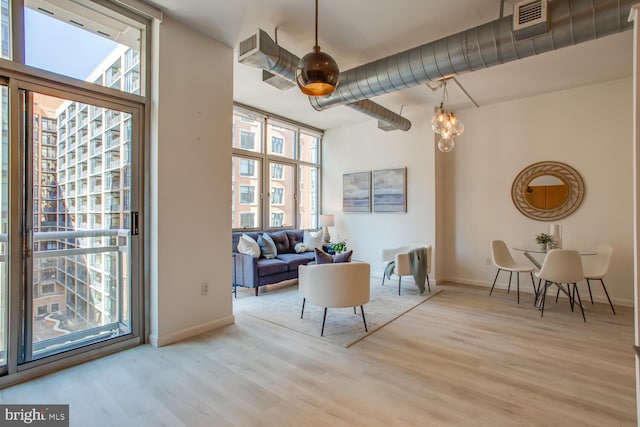 811 4th St NW Unit 608, Washington, DC 20001 - living area with healthy amount of natural light, wood finished floors, and baseboards