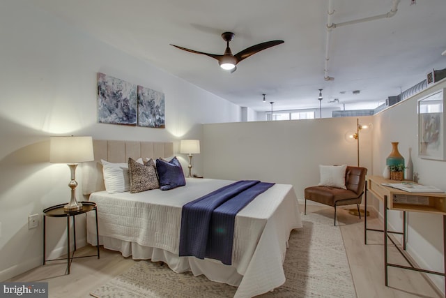 811 4th St NW Unit 608, Washington, DC 20001 - bedroom featuring wood finished floors and track lighting