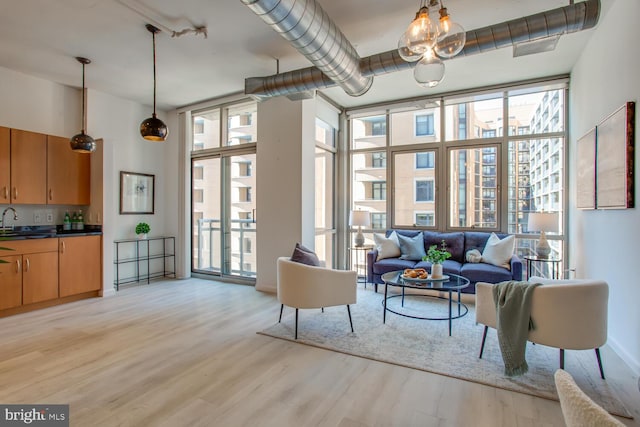 811 4th St NW Unit 608, Washington, DC 20001 - living area featuring expansive windows and light wood-style floors