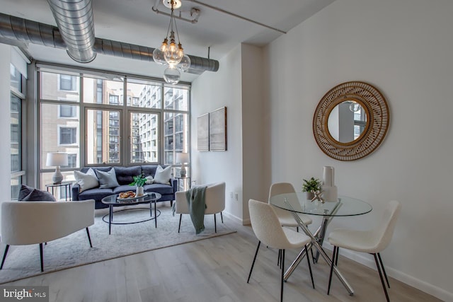 811 4th St NW Unit 608, Washington, DC 20001 - dining area with baseboards and wood finished floors