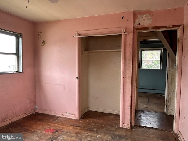 unfurnished bedroom featuring a baseboard radiator