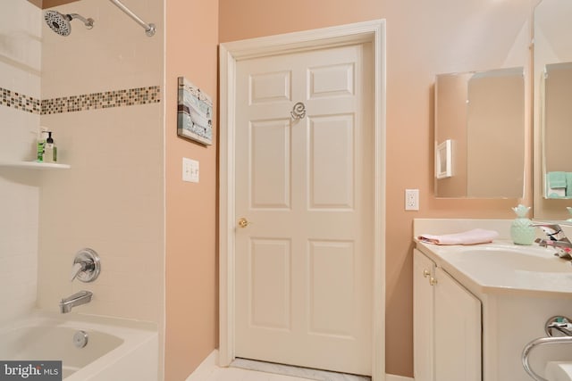 full bathroom with washtub / shower combination and vanity