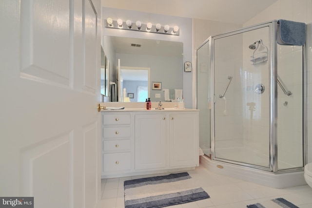 bathroom with a shower stall, tile patterned floors, and vanity
