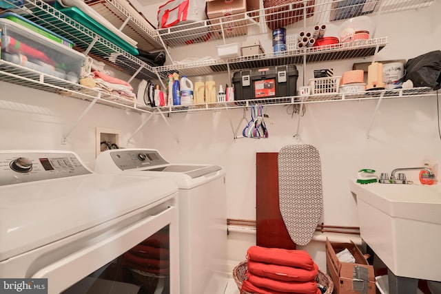 laundry room featuring separate washer and dryer