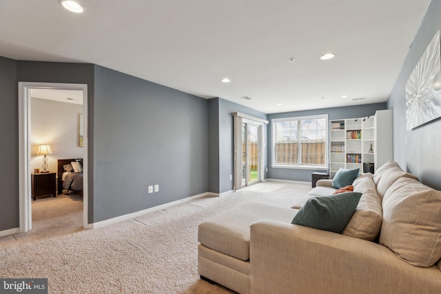 living area featuring carpet floors, recessed lighting, and baseboards