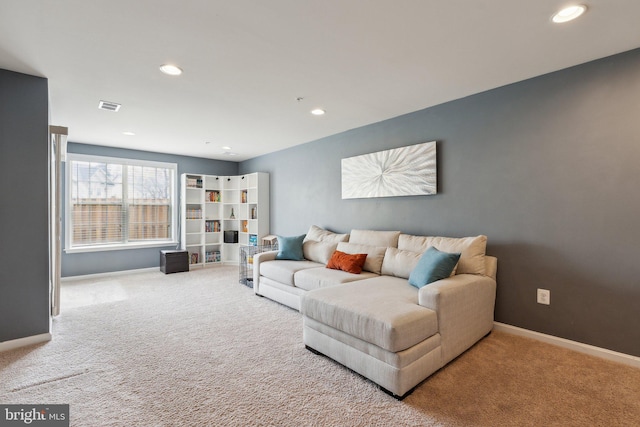 carpeted living area featuring visible vents, recessed lighting, and baseboards