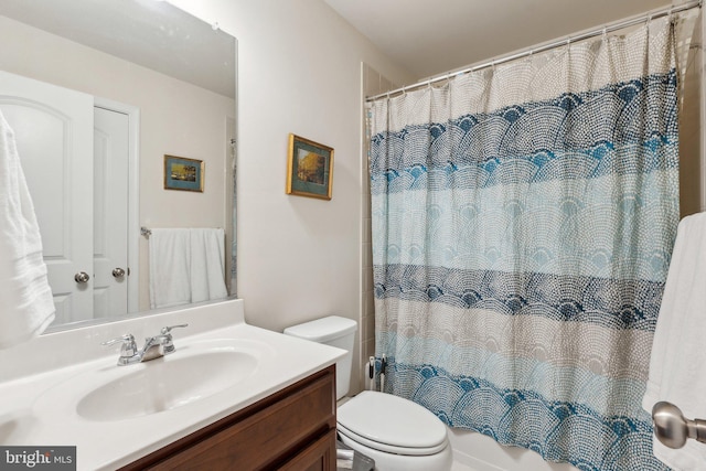 full bath featuring toilet and vanity