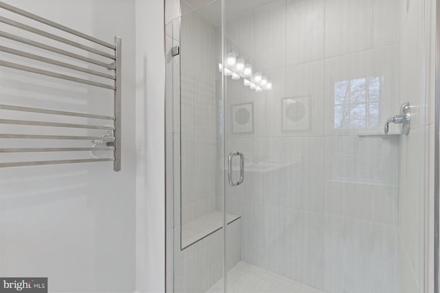 full bath featuring radiator heating unit and a shower stall