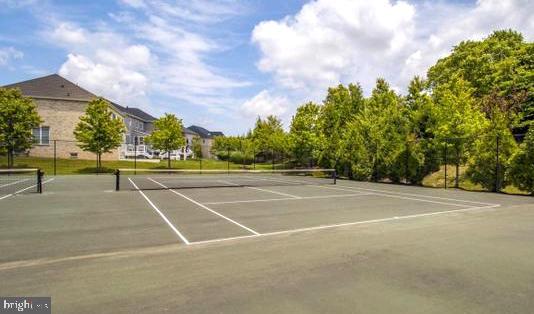 view of sport court with fence