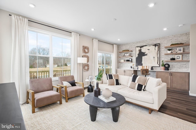 living room with wood finished floors and recessed lighting