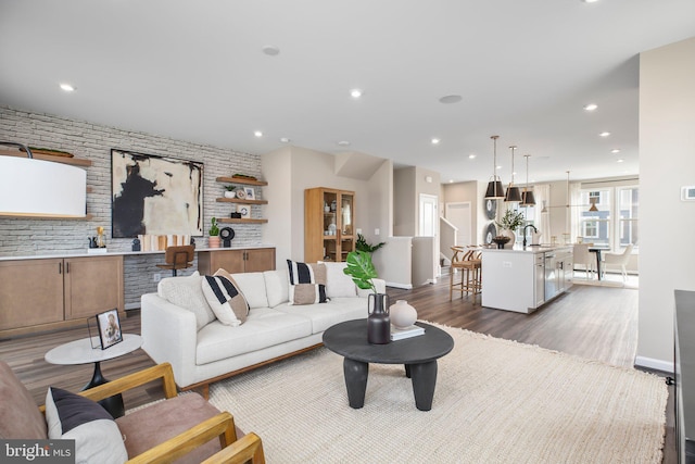 living room with wood finished floors and recessed lighting
