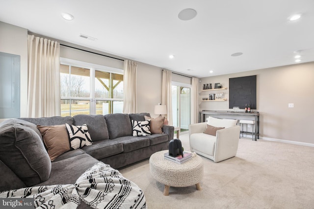 living room with carpet flooring, recessed lighting, baseboards, and visible vents