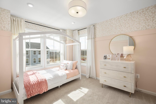bedroom with baseboards, wallpapered walls, recessed lighting, and light colored carpet