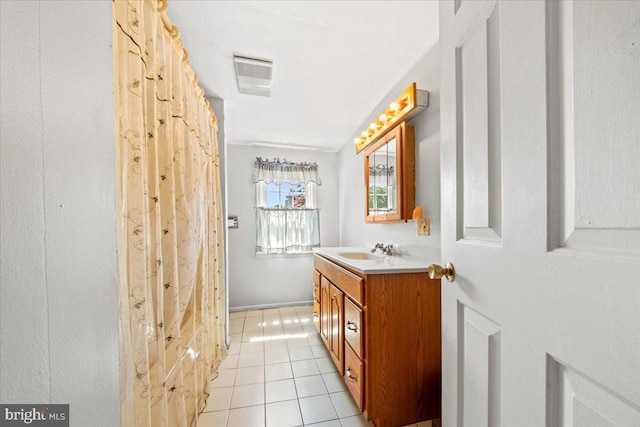 full bath featuring tile patterned floors, visible vents, and vanity