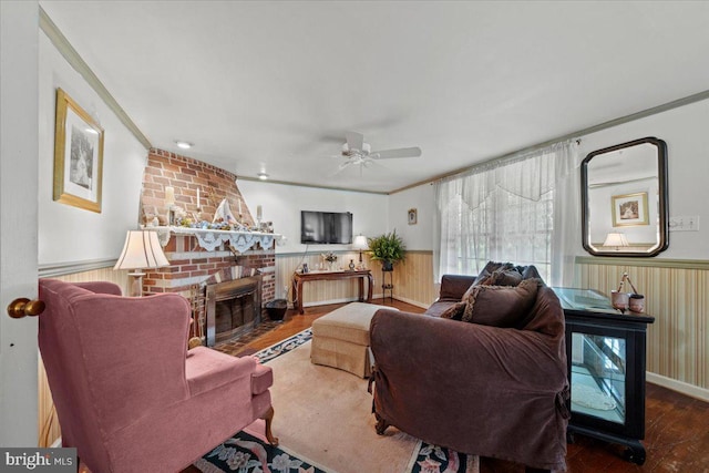 42 S Locust Ave, Marlton, NJ 08053 - living area featuring a wainscoted wall, ceiling fan, wood finished floors, a fireplace, and crown molding