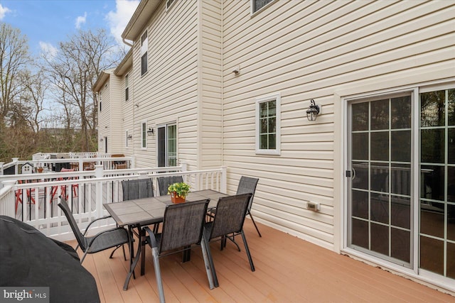 deck featuring outdoor dining area