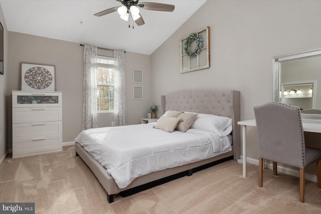 bedroom with carpet floors, baseboards, and lofted ceiling