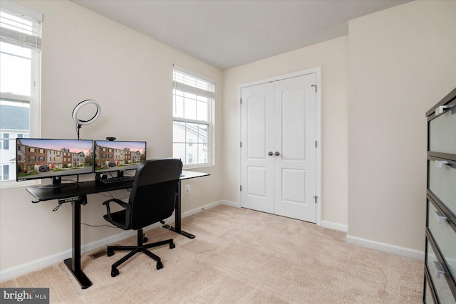 carpeted office with baseboards