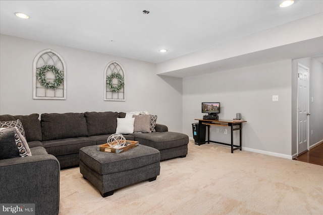 living area with light carpet, baseboards, and recessed lighting