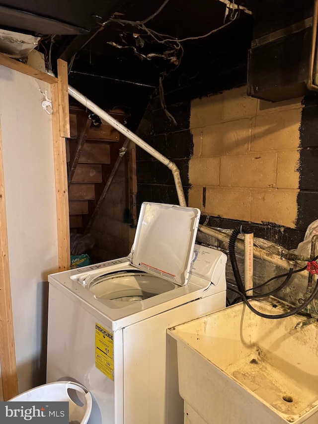 laundry room featuring washer / dryer and laundry area