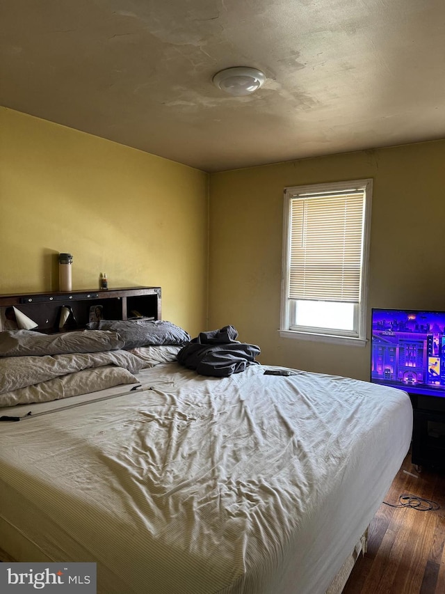 bedroom featuring wood finished floors