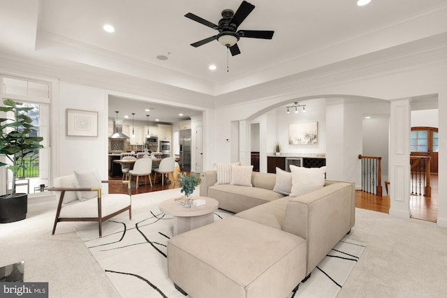 7521 Westfield Dr, Bethesda, MD 20817 - living area with a ceiling fan, recessed lighting, arched walkways, a raised ceiling, and ornamental molding