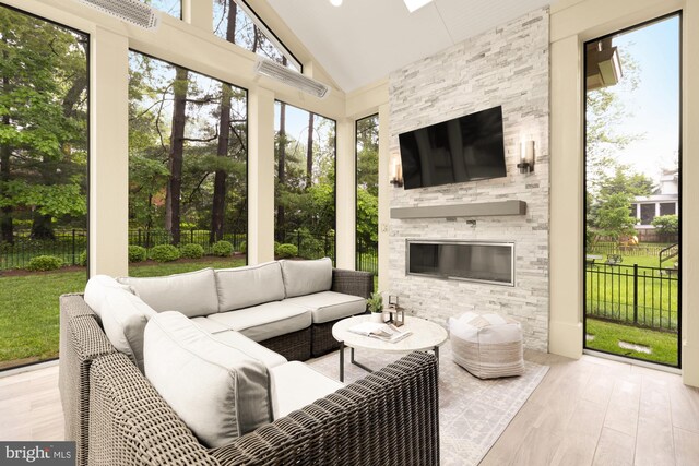7521 Westfield Dr, Bethesda, MD 20817 - sunroom featuring an outdoor living space with a fireplace and lofted ceiling