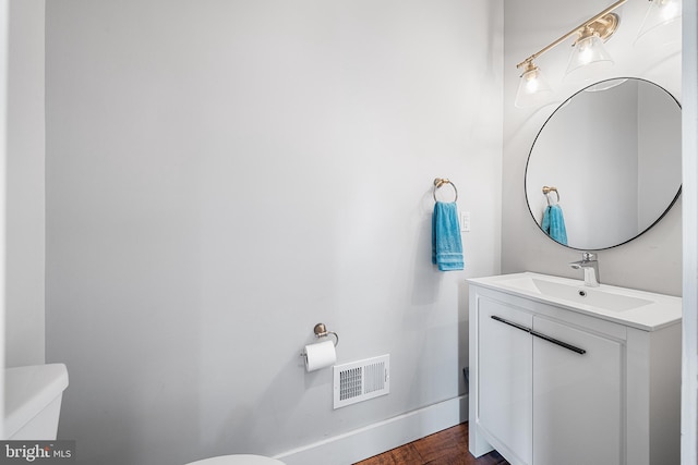 2650 E Huntingdon St, Philadelphia, PA 19125 - half bath with toilet, vanity, baseboards, and visible vents