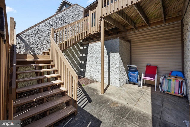 105 120th St Unit 111, Ocean City, MD 21842 - view of patio / terrace featuring a wooden deck and stairway