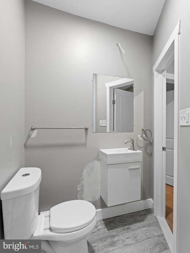bathroom with toilet and vanity