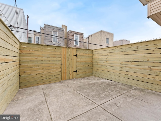 view of patio / terrace featuring fence