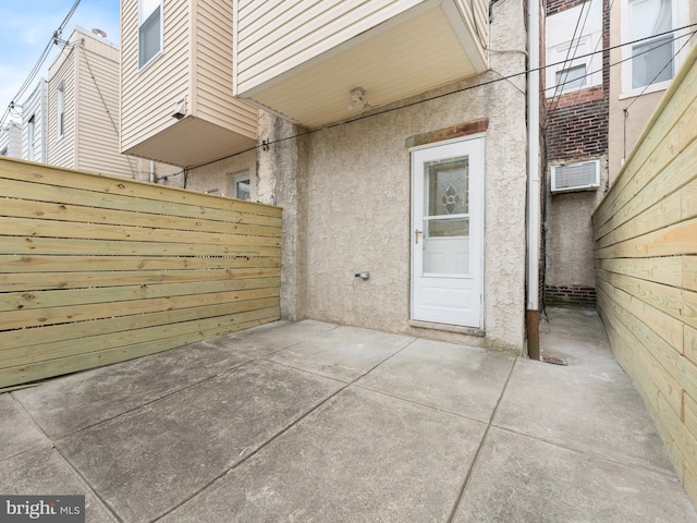 view of patio / terrace featuring fence