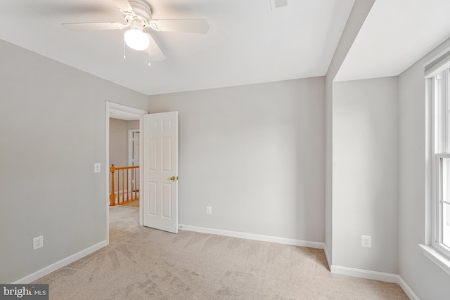 218 Foxborough Dr SW, Leesburg, VA 20175 - spare room featuring carpet flooring, baseboards, and a ceiling fan