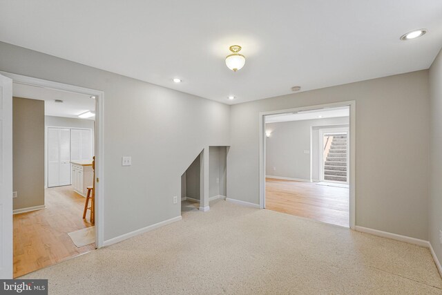218 Foxborough Dr SW, Leesburg, VA 20175 - unfurnished room featuring stairs, baseboards, and recessed lighting