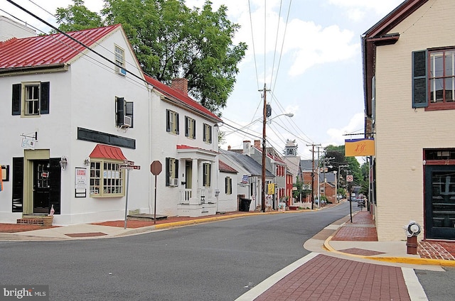 218 Foxborough Dr SW, Leesburg, VA 20175 - view of street featuring street lights, traffic signs, curbs, and sidewalks