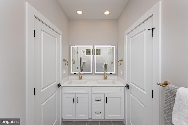 1032 Terrace Gln, Baltimore, MD 21210 - bathroom featuring double vanity, a stall shower, tile patterned flooring, and recessed lighting