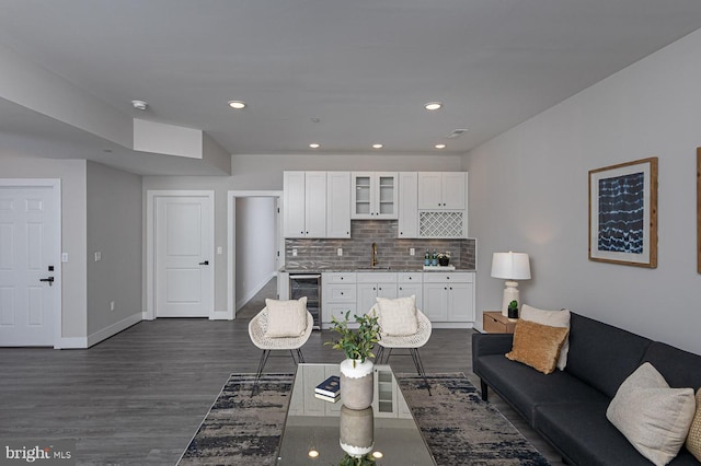 1032 Terrace Gln, Baltimore, MD 21210 - living area with beverage cooler, dark wood-type flooring, recessed lighting, and baseboards