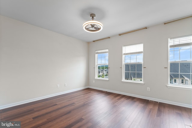 5957 Whelan Ln, Frederick, MD 21703 - empty room featuring dark wood finished floors and baseboards