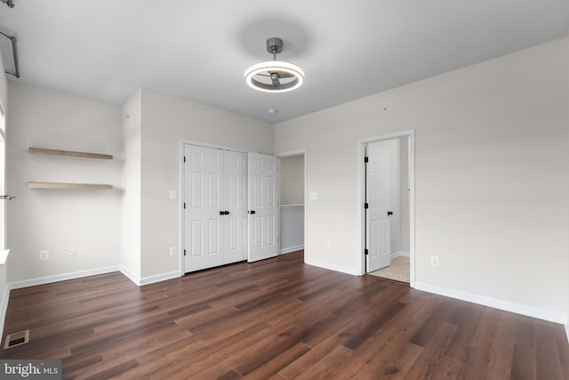 5957 Whelan Ln, Frederick, MD 21703 - unfurnished bedroom with wood finished floors, baseboards, and a closet
