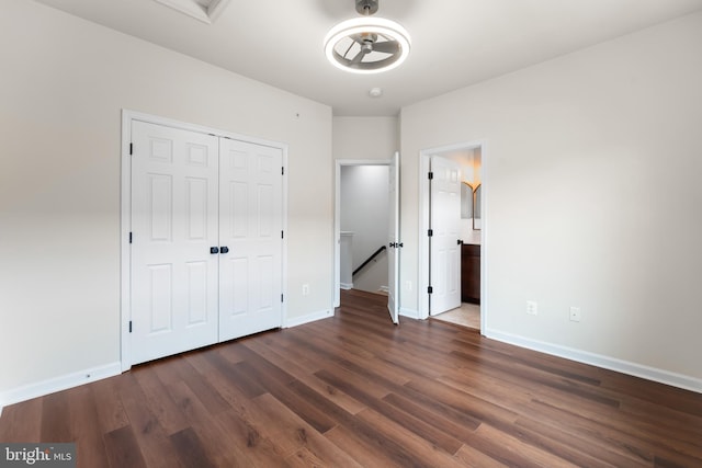 5957 Whelan Ln, Frederick, MD 21703 - unfurnished bedroom with dark wood-style floors, a closet, baseboards, and ensuite bathroom
