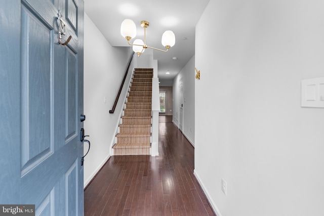 5957 Whelan Ln, Frederick, MD 21703 - foyer featuring stairs, a chandelier, dark wood-type flooring, and baseboards