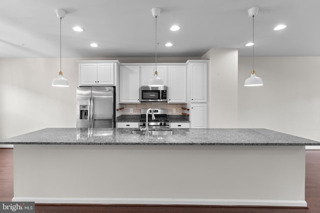 5957 Whelan Ln, Frederick, MD 21703 - kitchen featuring appliances with stainless steel finishes, white cabinetry, a large island, tasteful backsplash, and recessed lighting