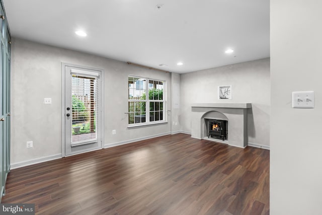 5957 Whelan Ln, Frederick, MD 21703 - unfurnished living room featuring dark wood finished floors, recessed lighting, baseboards, and a lit fireplace