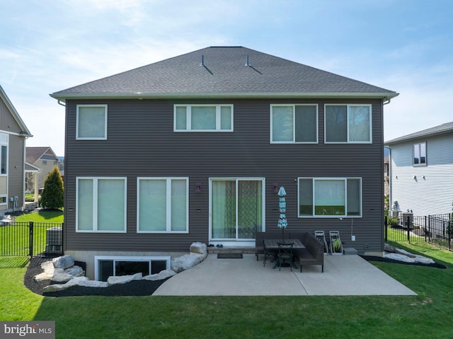 rear view of house featuring fence, roof with shingles, a patio area, central air condition unit, and a yard