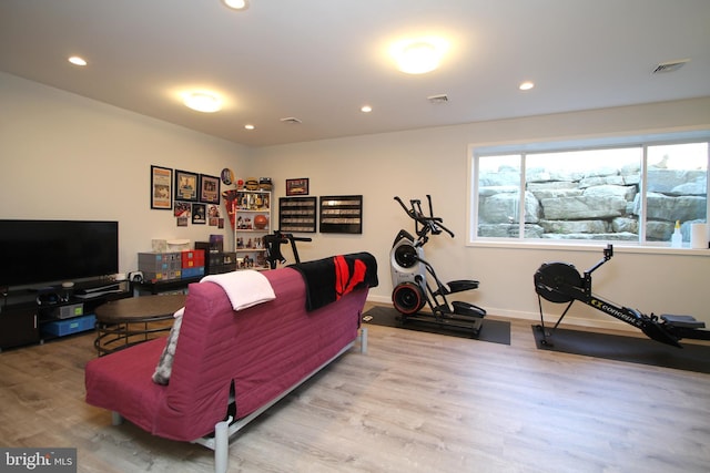 living room featuring baseboards, recessed lighting, wood finished floors, and visible vents