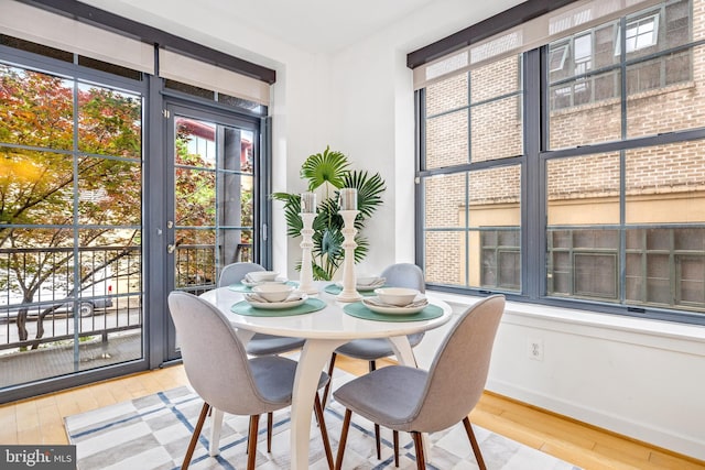 2412 17th St NW Unit 102, Washington, DC 20009 - dining area featuring wood-type flooring and baseboards